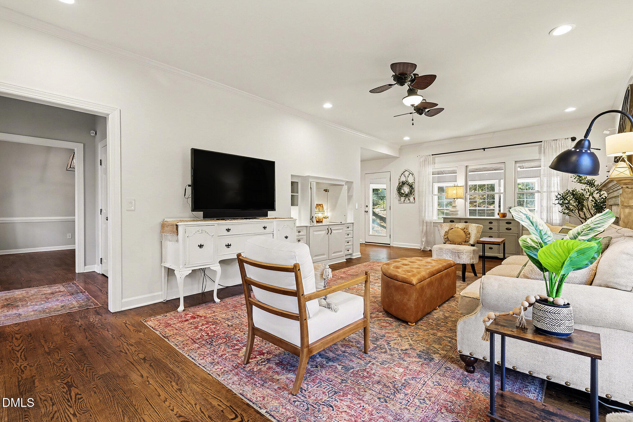 4121 Summer Ridge Court Apex, NC 27539 - Photo 8 of 29 a living room with furniture and a flat screen tv