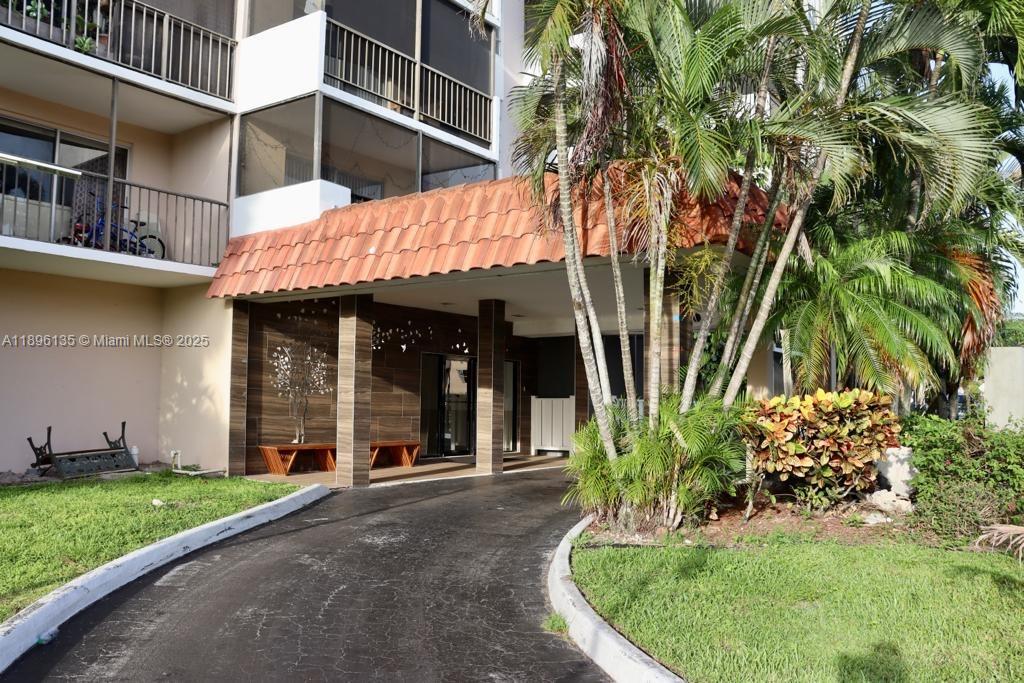 4164 Inverrary Drive, Unit 408 Lauderhill, FL 33319 - Photo 7 of 14 a view of a house with a flower garden