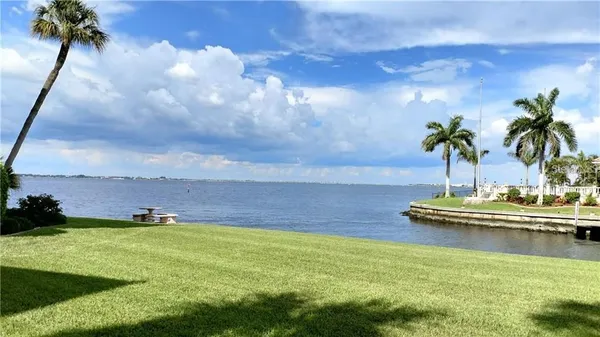 a view of a lake with a yard