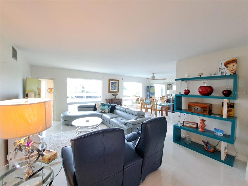 1 Colony Point Drive, Unit A5 Punta Gorda, FL 33950 - Photo 13 of 37 a living room with furniture and a flat screen tv