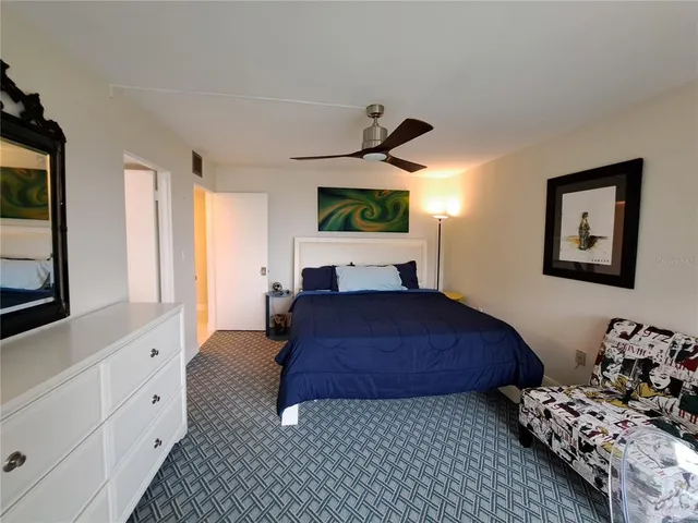 a bedroom with bed and window