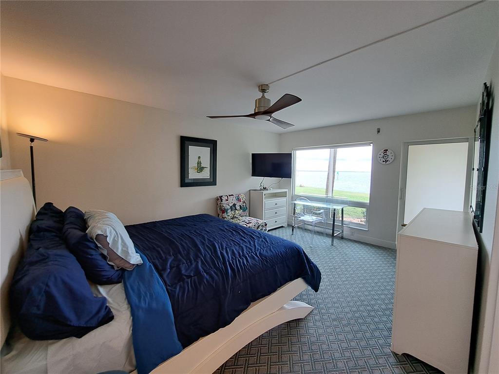 1 Colony Point Drive, Unit A5 Punta Gorda, FL 33950 - Photo 19 of 37 a living room with furniture and a flat screen tv