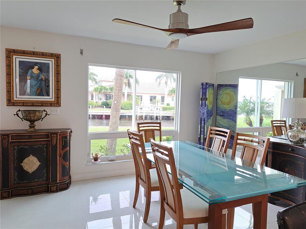 1 Colony Point Drive, Unit A5 Punta Gorda, FL 33950 - Photo 27 of 37 a view of a dining room with furniture window and outside view