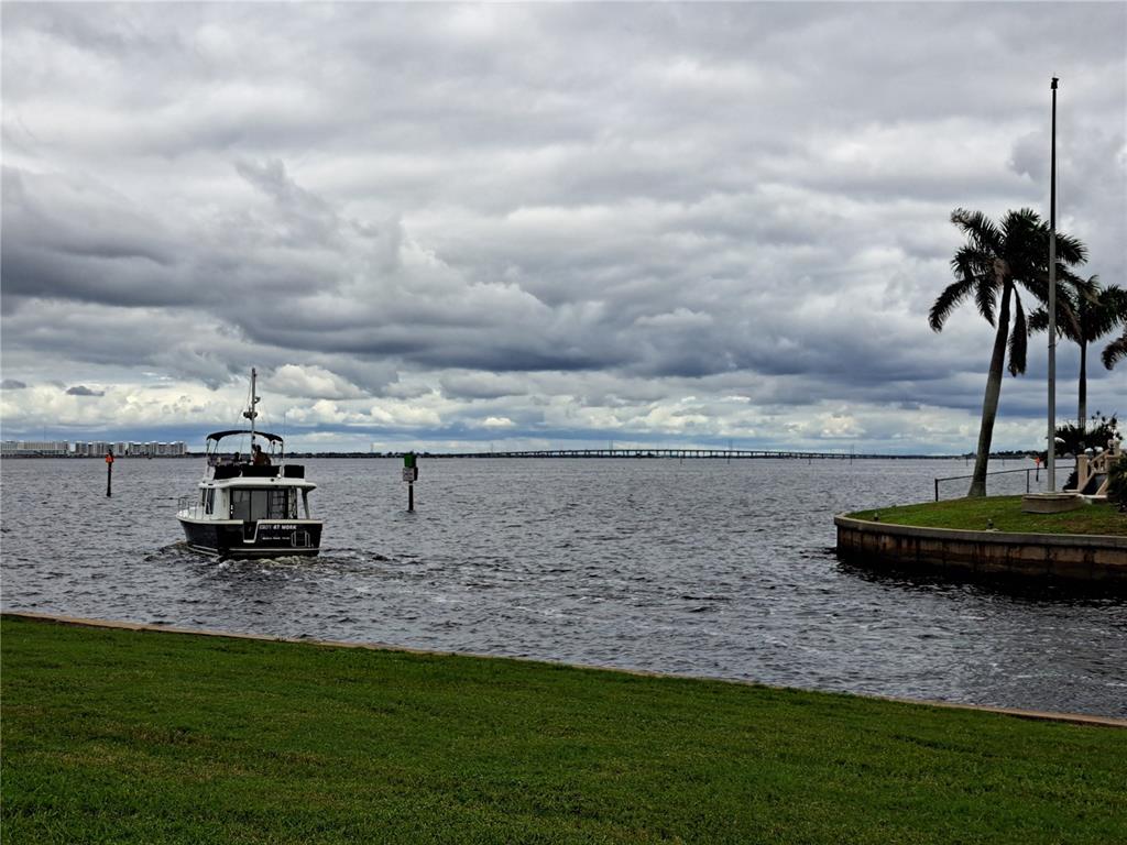 1 Colony Point Drive, Unit A5 Punta Gorda, FL 33950 - Photo 36 of 37 a view of a lake with a big yard