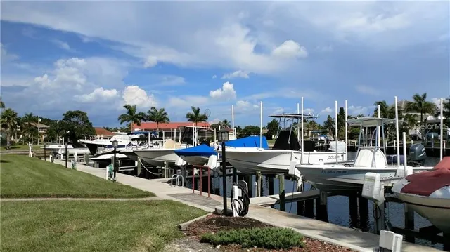 a view of a patio with dining table and chairs with a stove