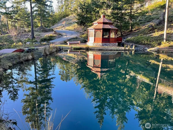 a view of a lake with a yard