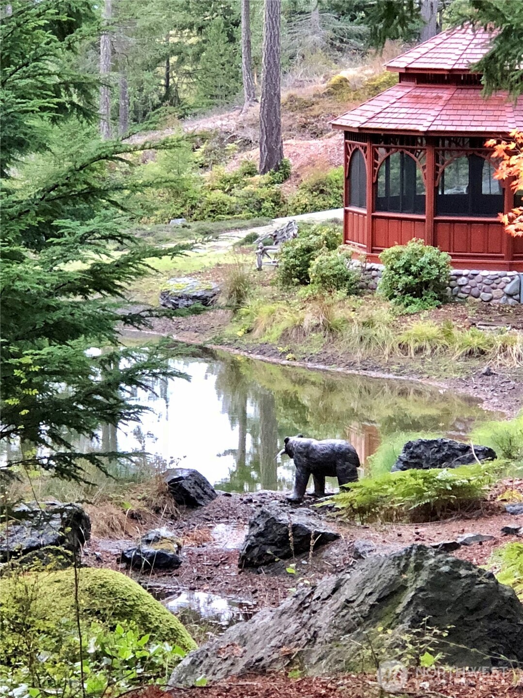 1656 Eagle Ridge Road Orcas Island, WA 98245 - Photo 33 of 40 a view of a lake with a table and chairs under an umbrella