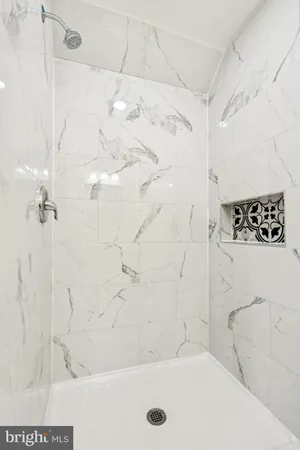 a bathroom with a bathtub and shower
