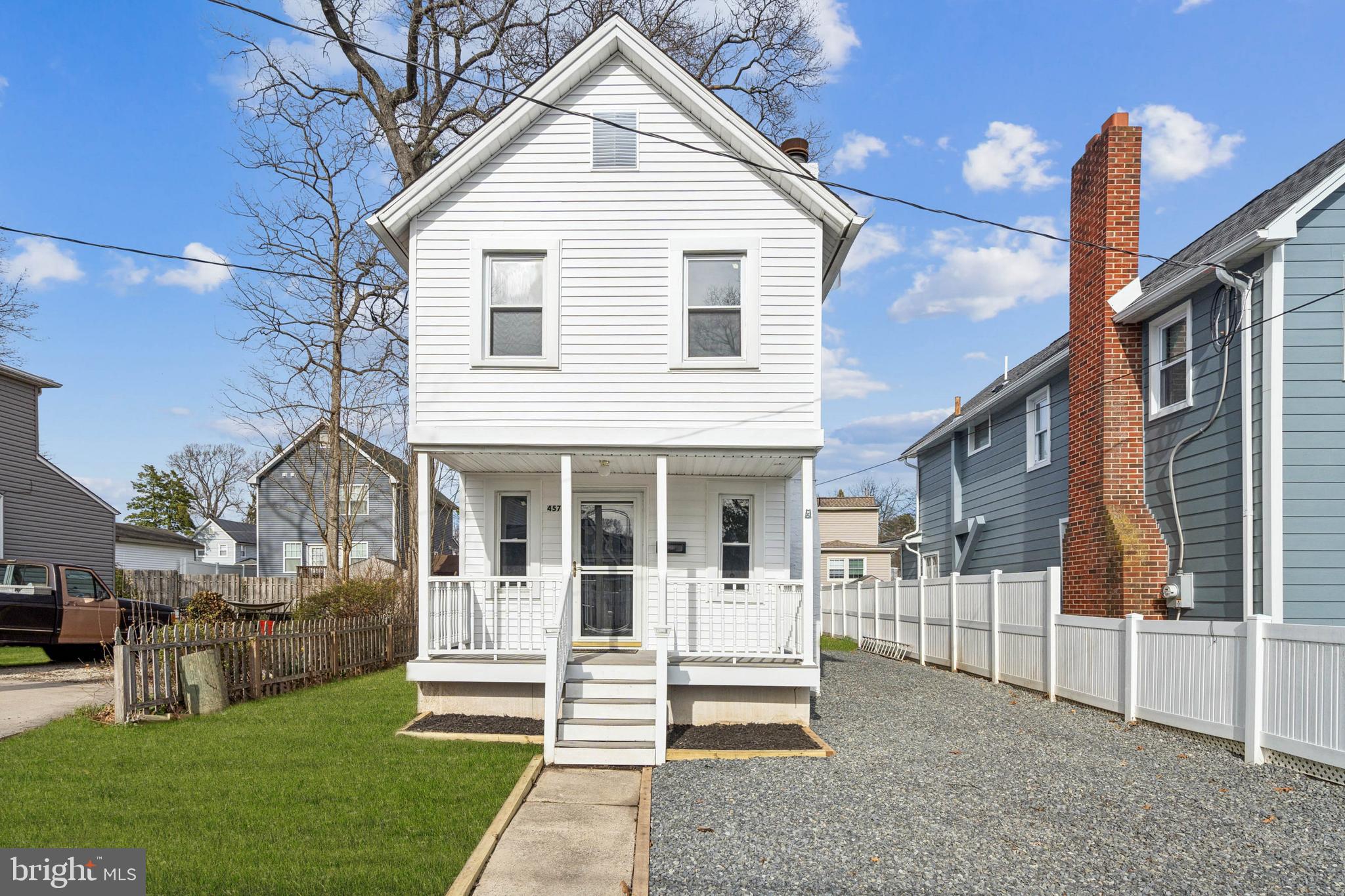 457 Wesley Avenue Pitman, NJ 08071 - Photo 2 of 25 a view of a white house with a yard and plants