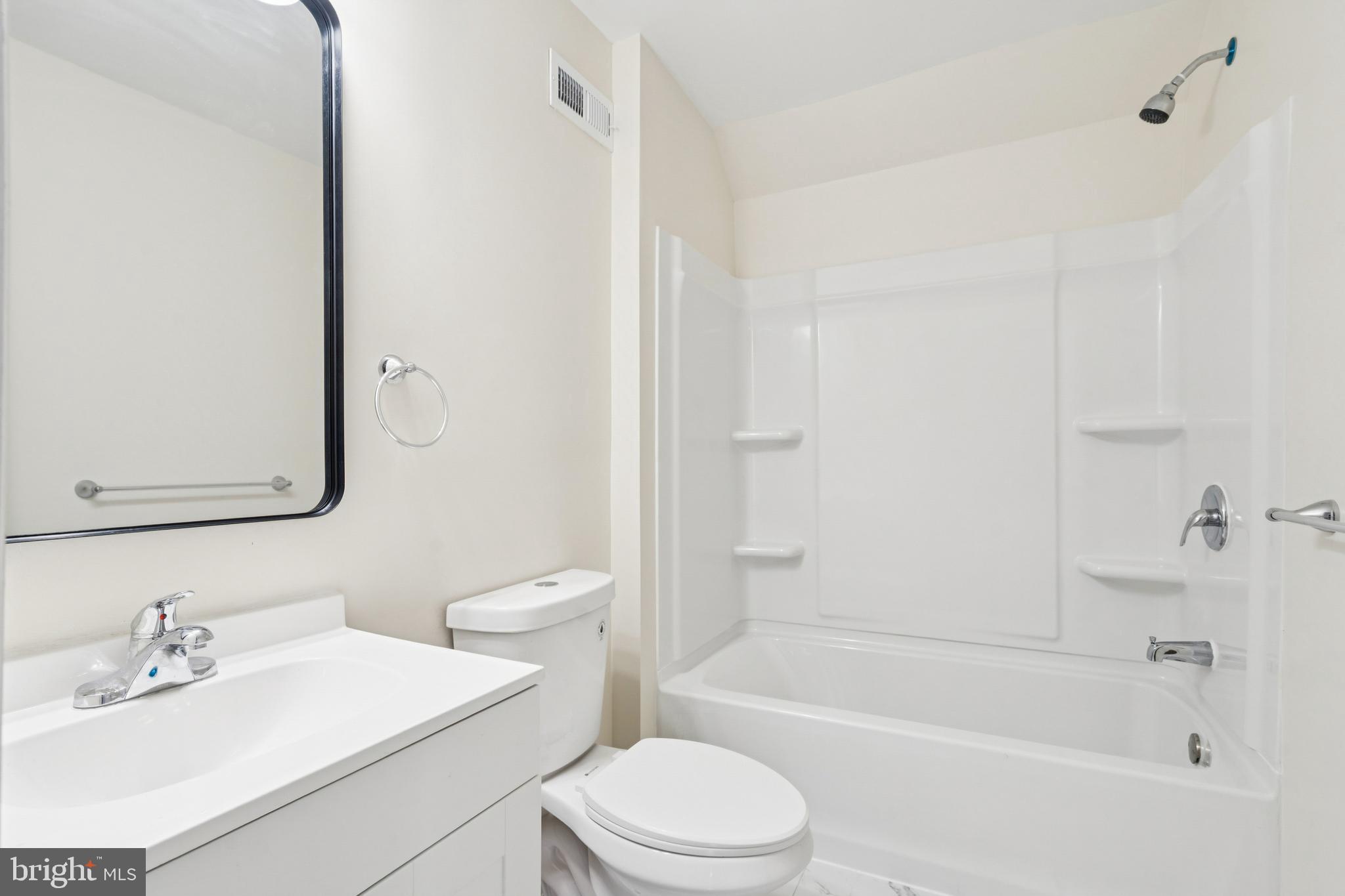 457 Wesley Avenue Pitman, NJ 08071 - Photo 23 of 25 a bathroom with a sink a toilet and a bathtub