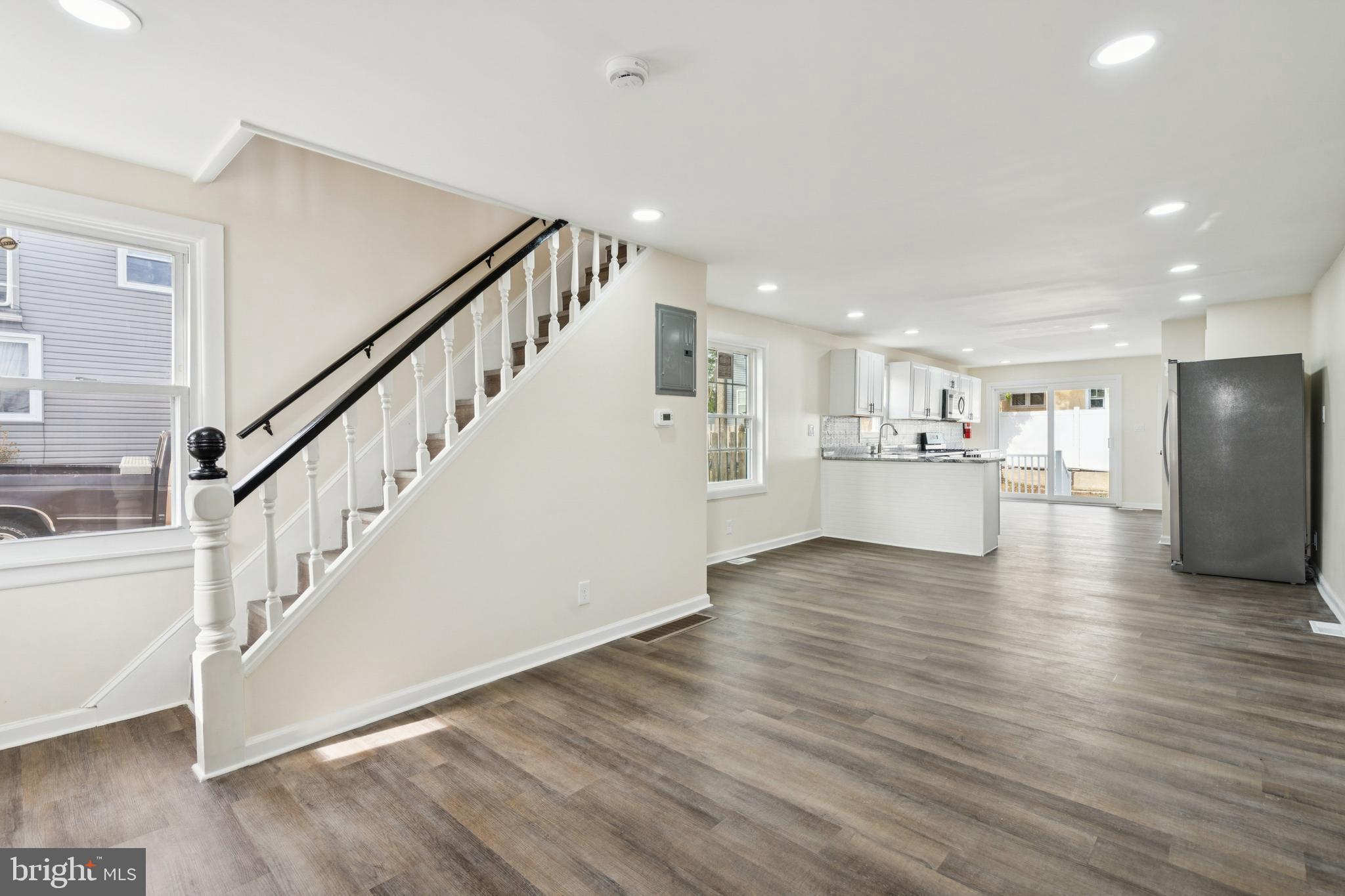 457 Wesley Avenue Pitman, NJ 08071 - Photo 5 of 25 a view of a kitchen with wooden floor and electronic appliances