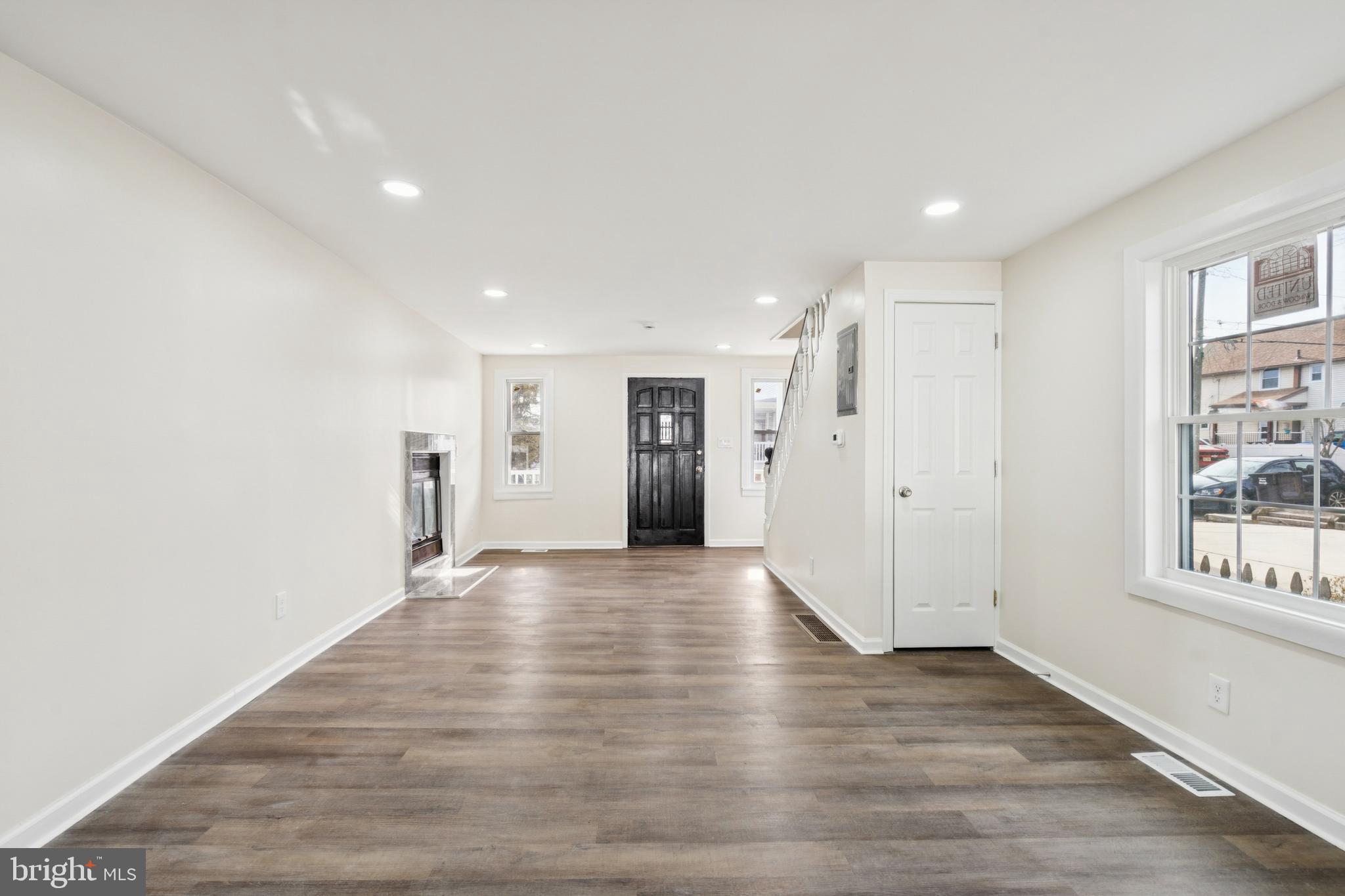 457 Wesley Avenue Pitman, NJ 08071 - Photo 8 of 25 a view of an empty room with wooden floor and windows