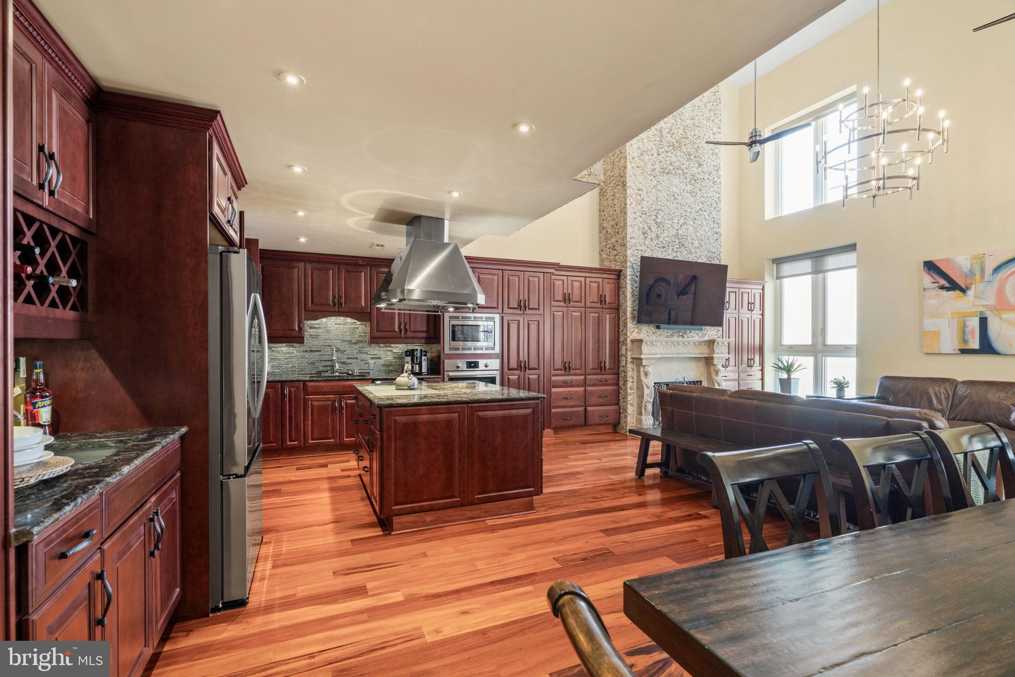 802 Locust Street, Unit 201 Philadelphia, PA 19107 - Photo 3 of 53 Elegant kitchen with rich wood tones.
