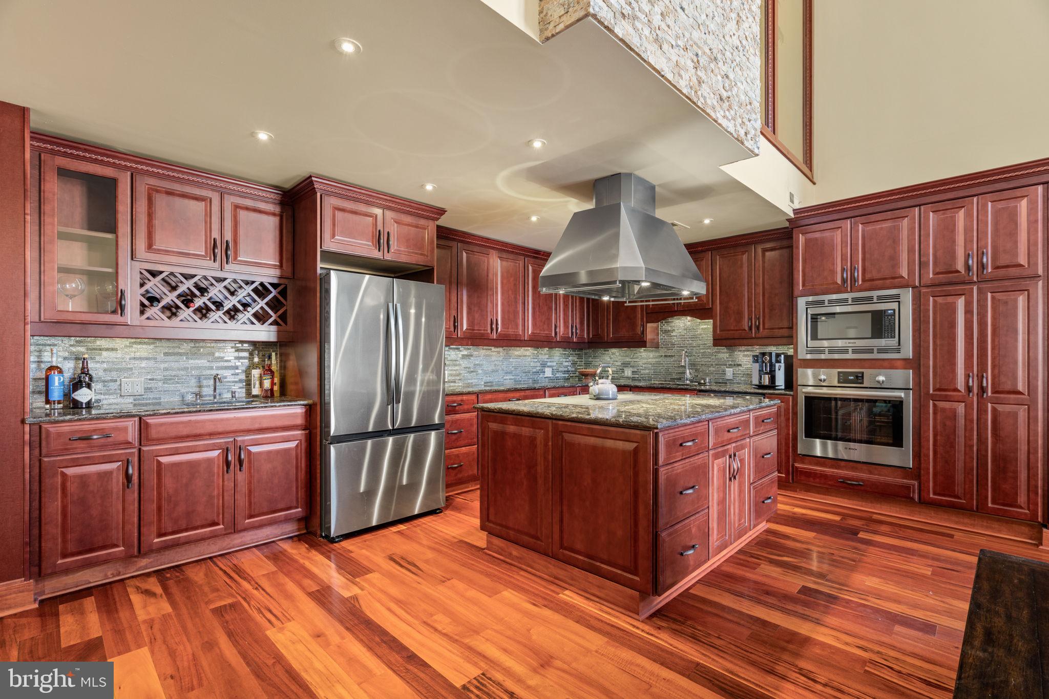 802 Locust Street, Unit 201 Philadelphia, PA 19107 - Photo 5 of 53 Elegant kitchen with rich wood tones.