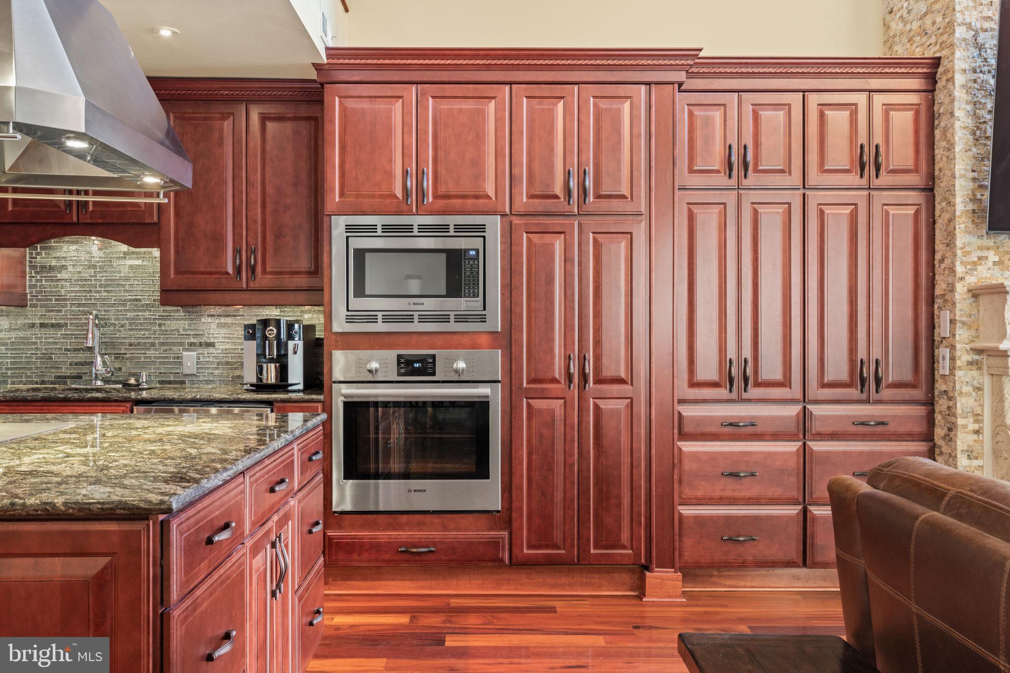 802 Locust Street, Unit 201 Philadelphia, PA 19107 - Photo 6 of 53 Elegant kitchen with rich wood cabinetry.