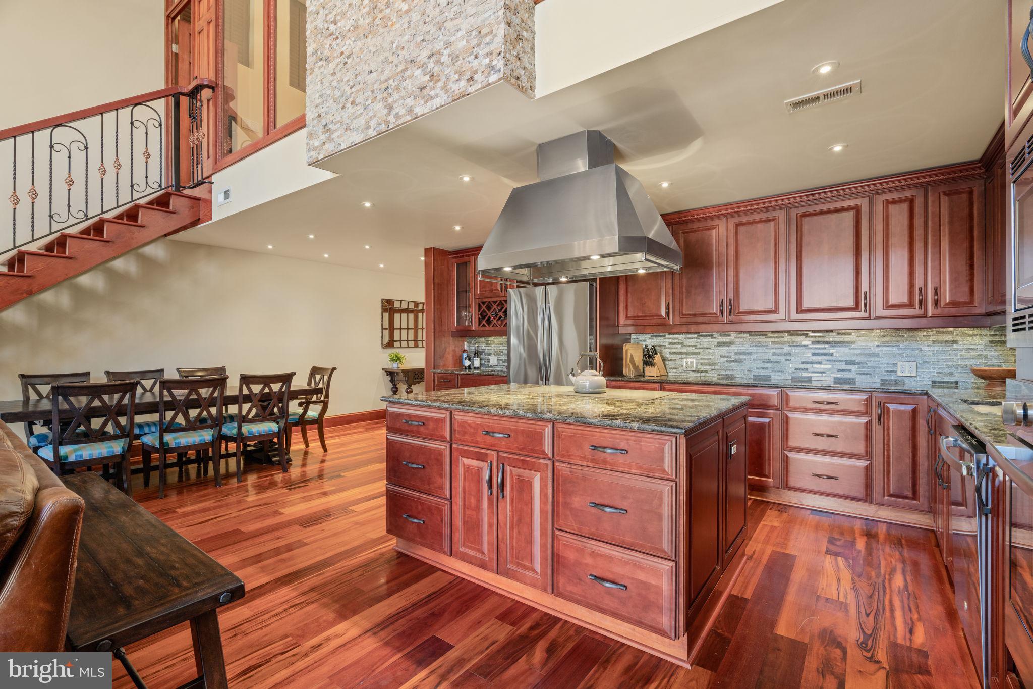 802 Locust Street, Unit 201 Philadelphia, PA 19107 - Photo 9 of 53 Elegant kitchen with rich wood tones.