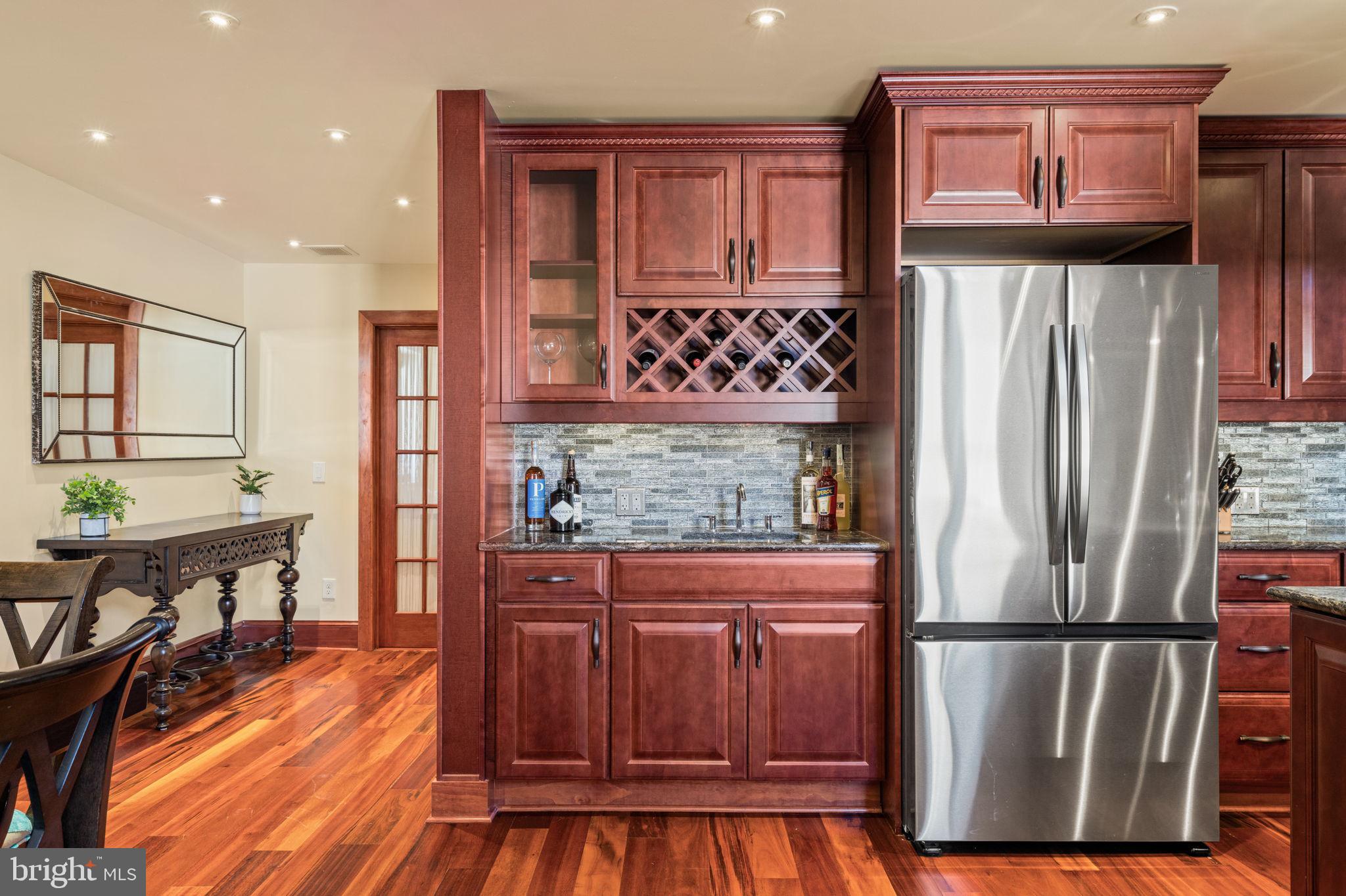 802 Locust Street, Unit 201 Philadelphia, PA 19107 - Photo 10 of 53 Elegant kitchen with rich wood tones.