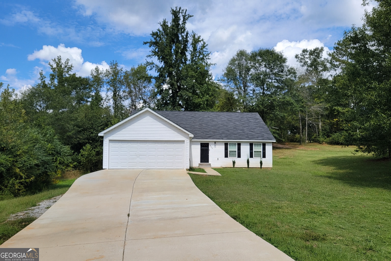 a house view with a garden space