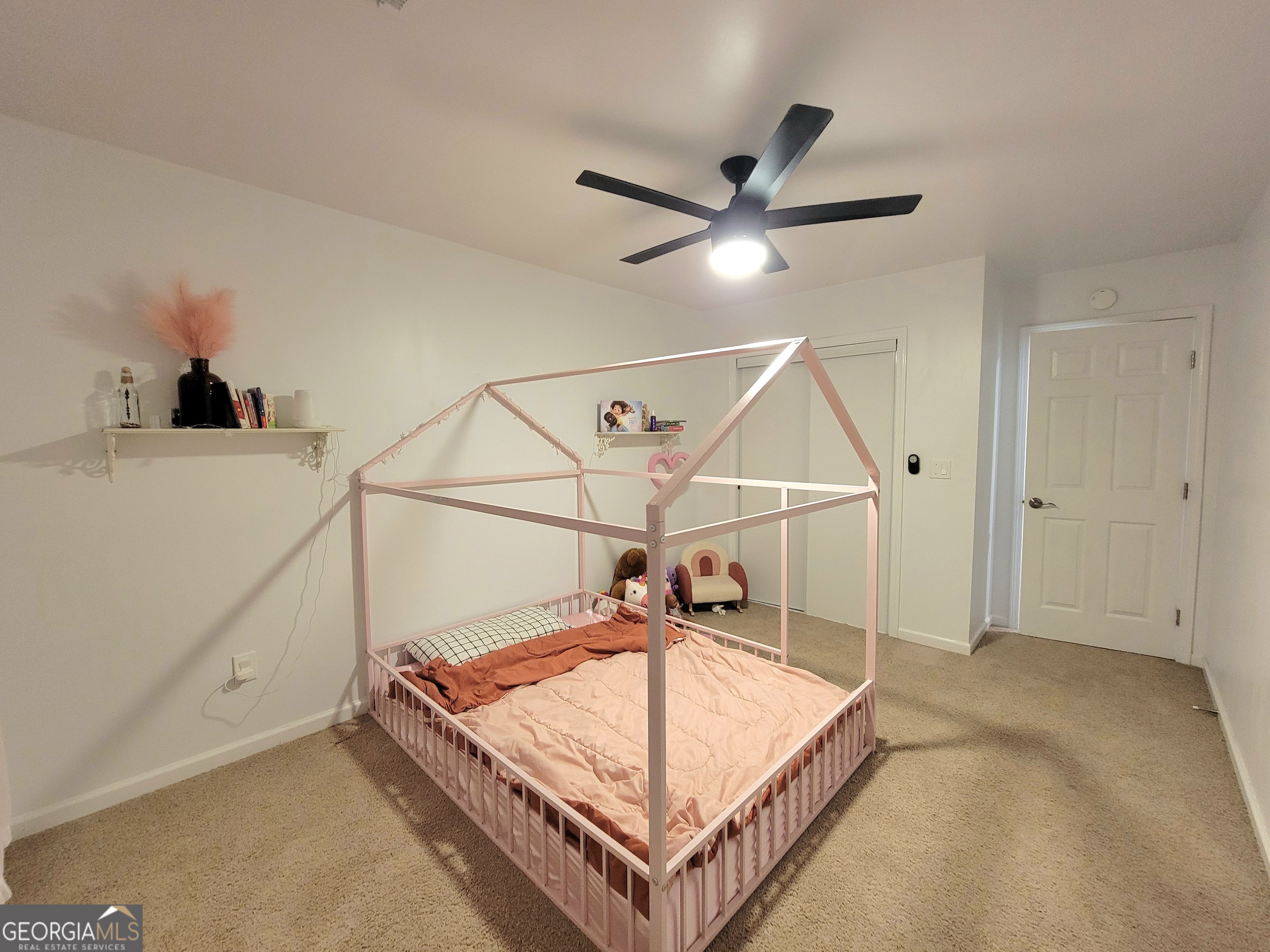 524 Louina Road Roanoke, AL 36274 - Photo 11 of 24 a bedroom with a bed and a chandelier