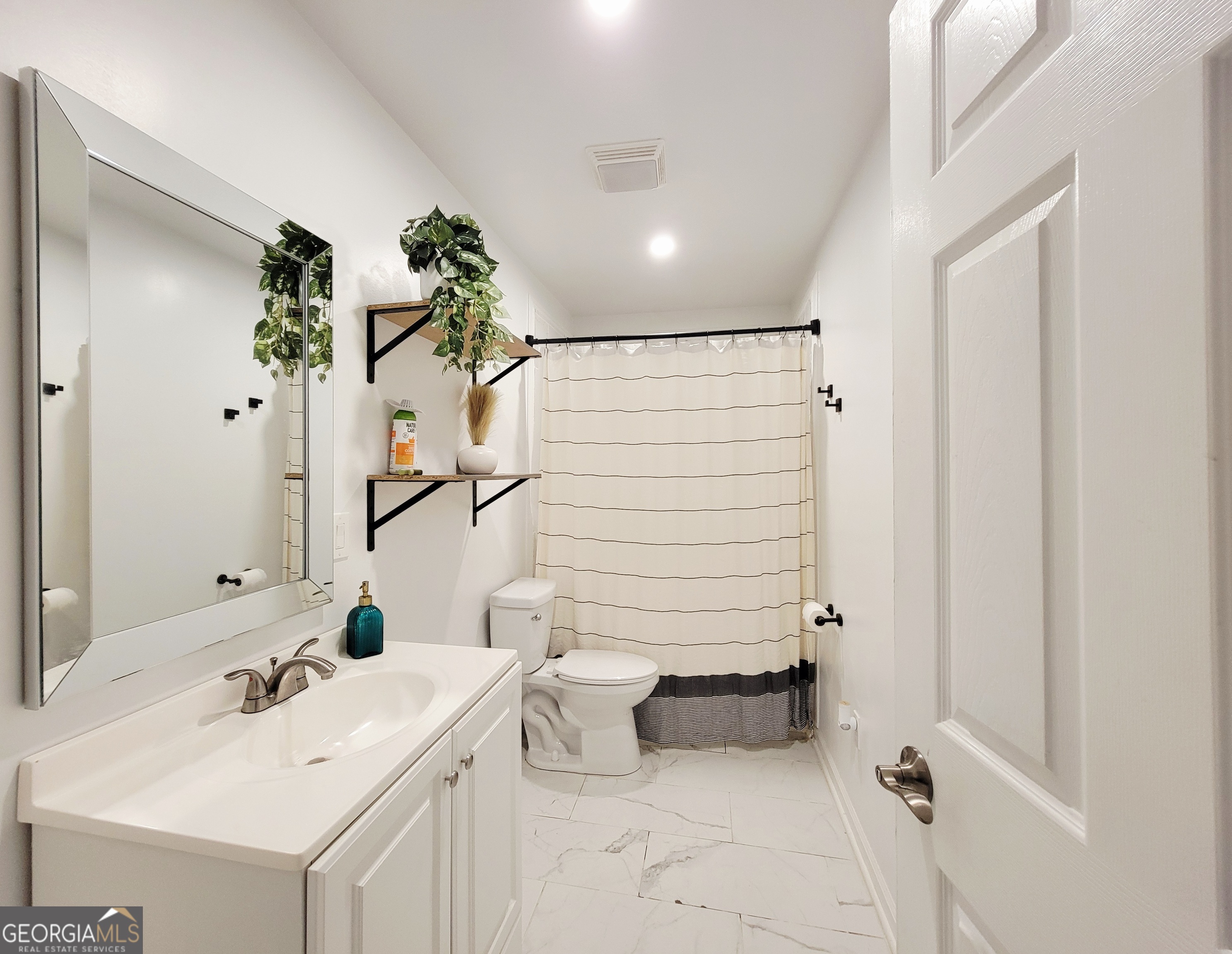 524 Louina Road Roanoke, AL 36274 - Photo 15 of 24 a bathroom with a sink and a mirror