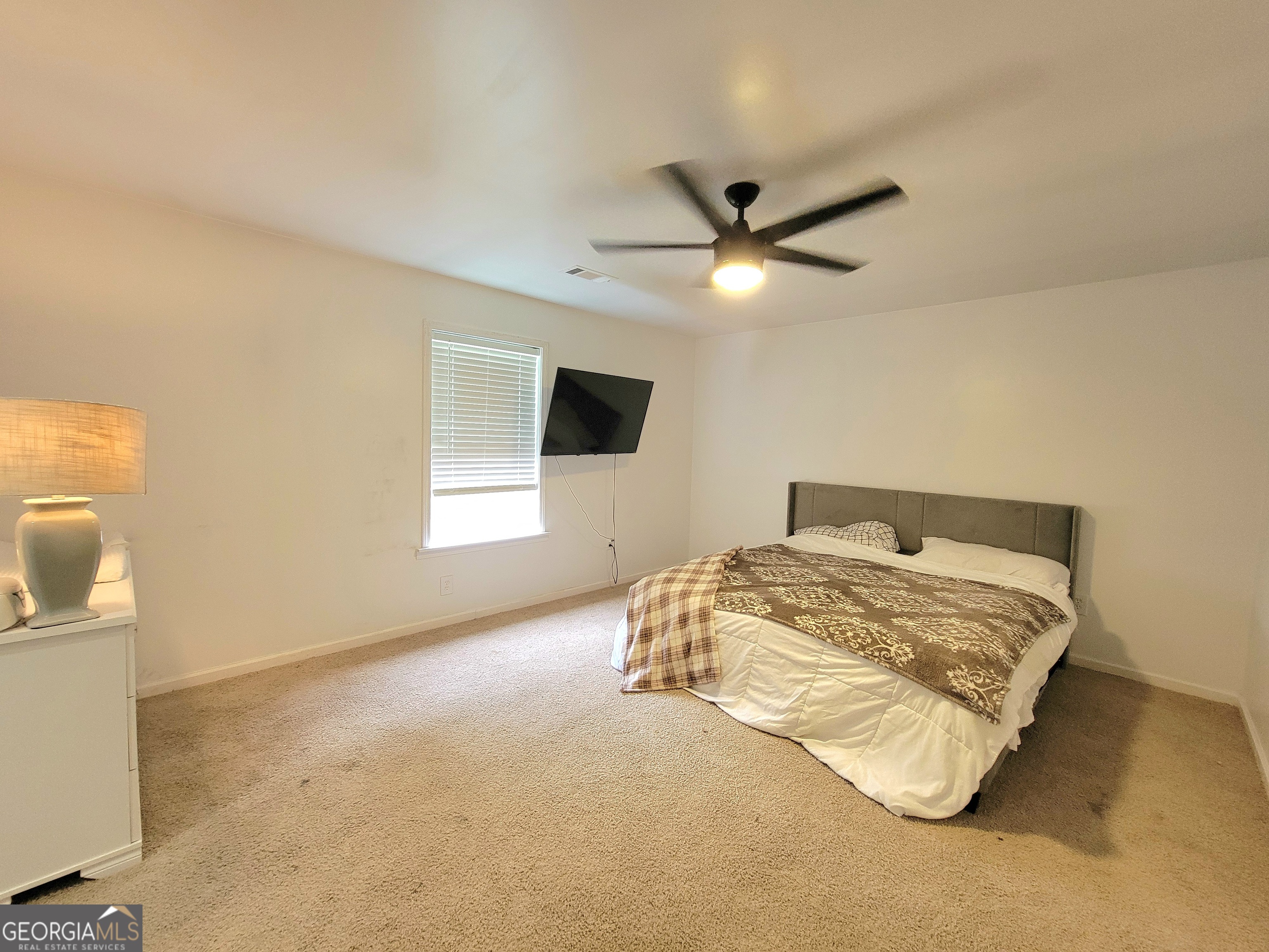 524 Louina Road Roanoke, AL 36274 - Photo 18 of 24 a bed sitting in a room next to a window