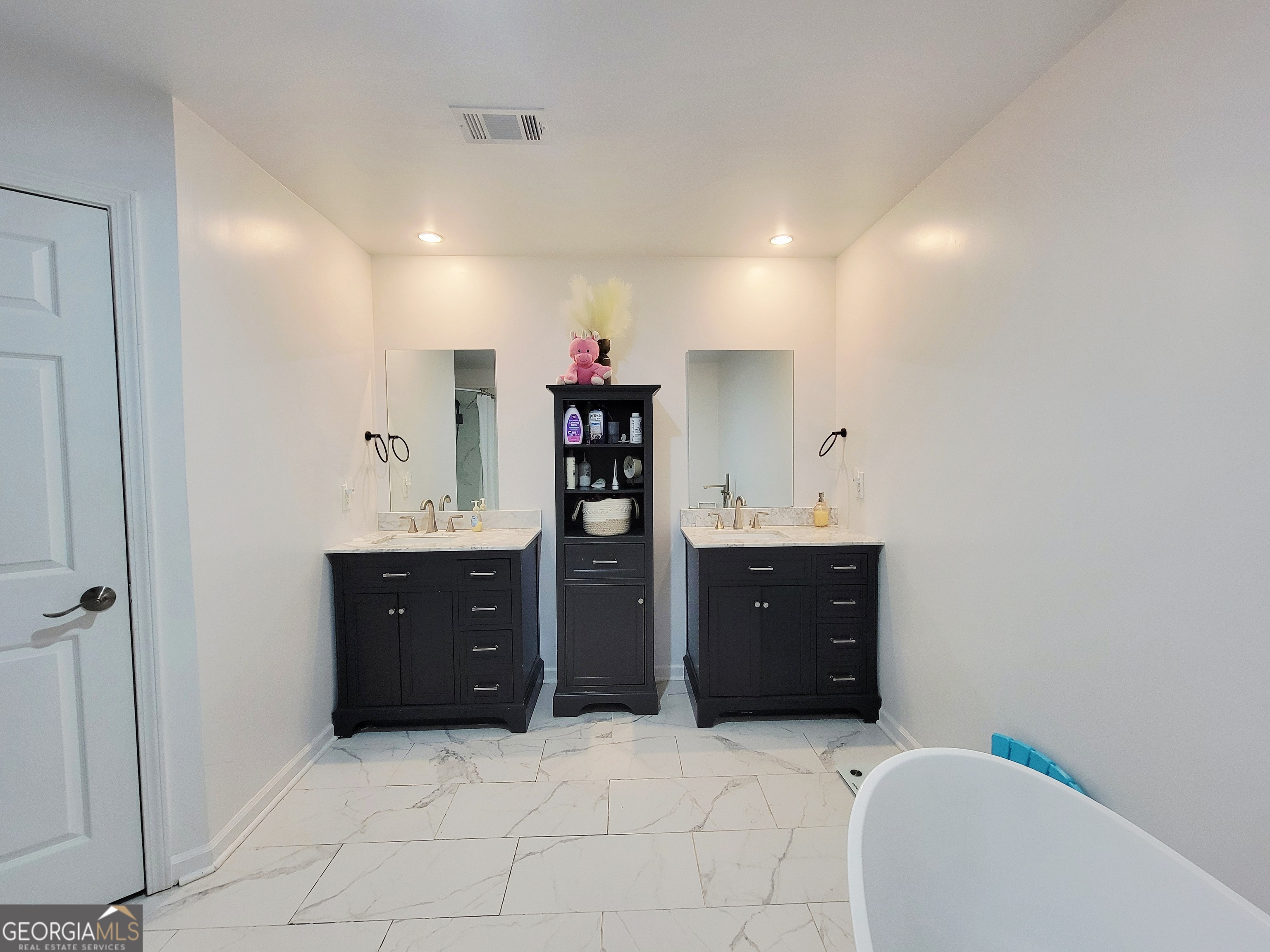 524 Louina Road Roanoke, AL 36274 - Photo 21 of 24 a spacious bathroom with a sink double vanity and a mirror