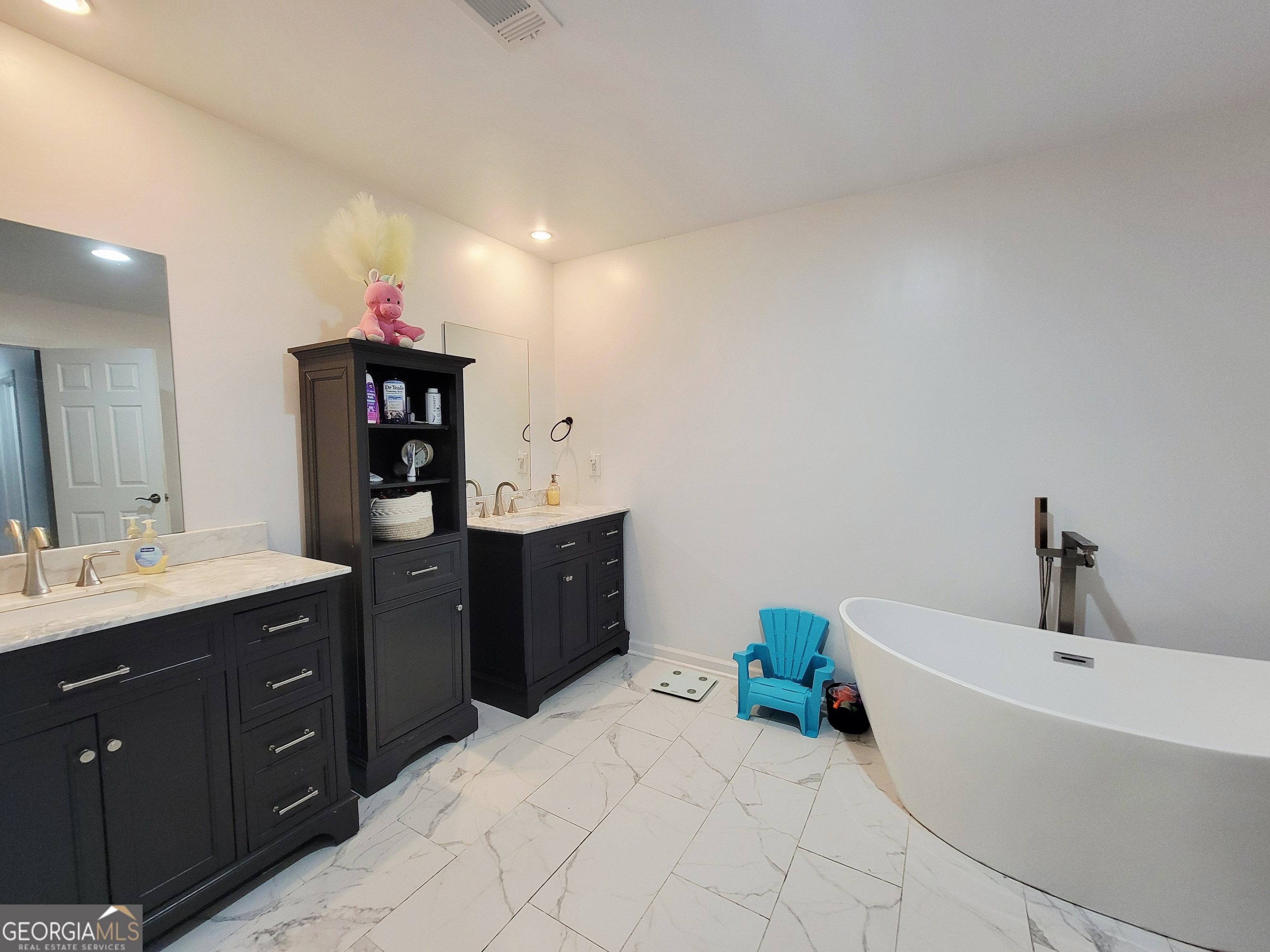 524 Louina Road Roanoke, AL 36274 - Photo 23 of 24 a spacious bathroom with a tub sink and mirror