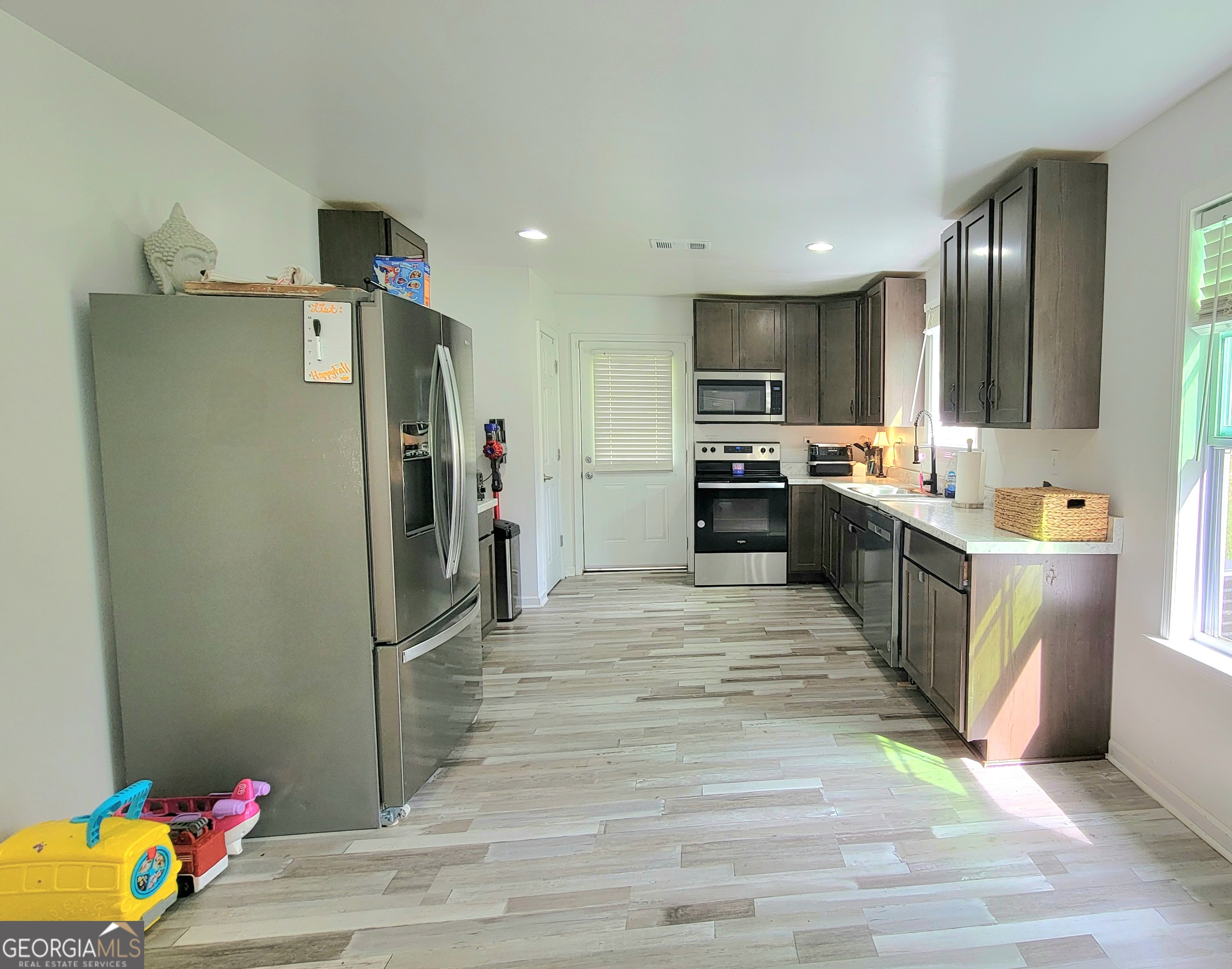 524 Louina Road Roanoke, AL 36274 - Photo 6 of 24 a kitchen with stainless steel appliances granite countertop a refrigerator and a sink