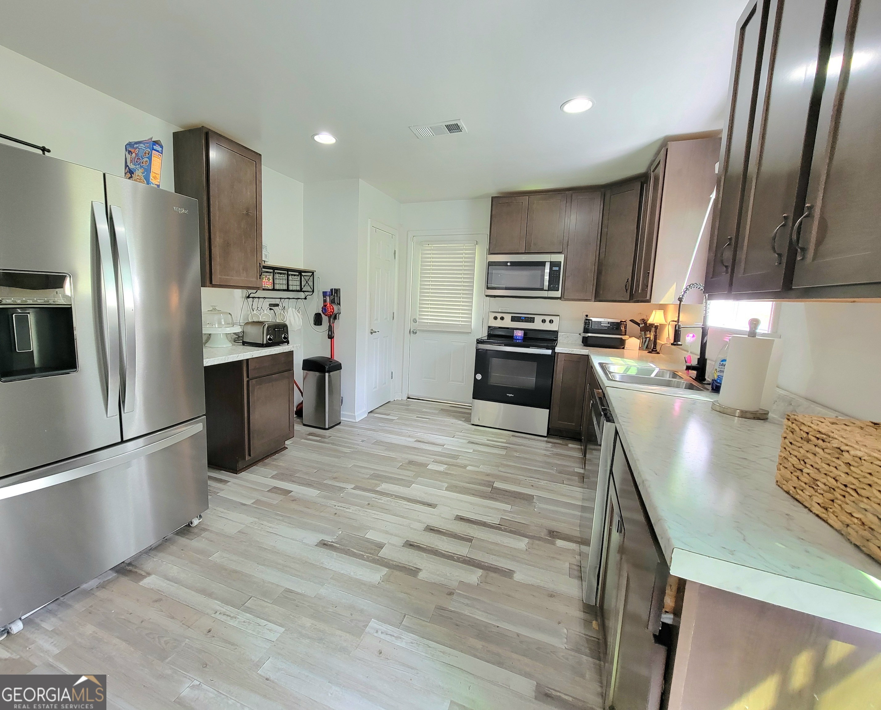 524 Louina Road Roanoke, AL 36274 - Photo 8 of 24 a kitchen with stainless steel appliances granite countertop a refrigerator stove and oven