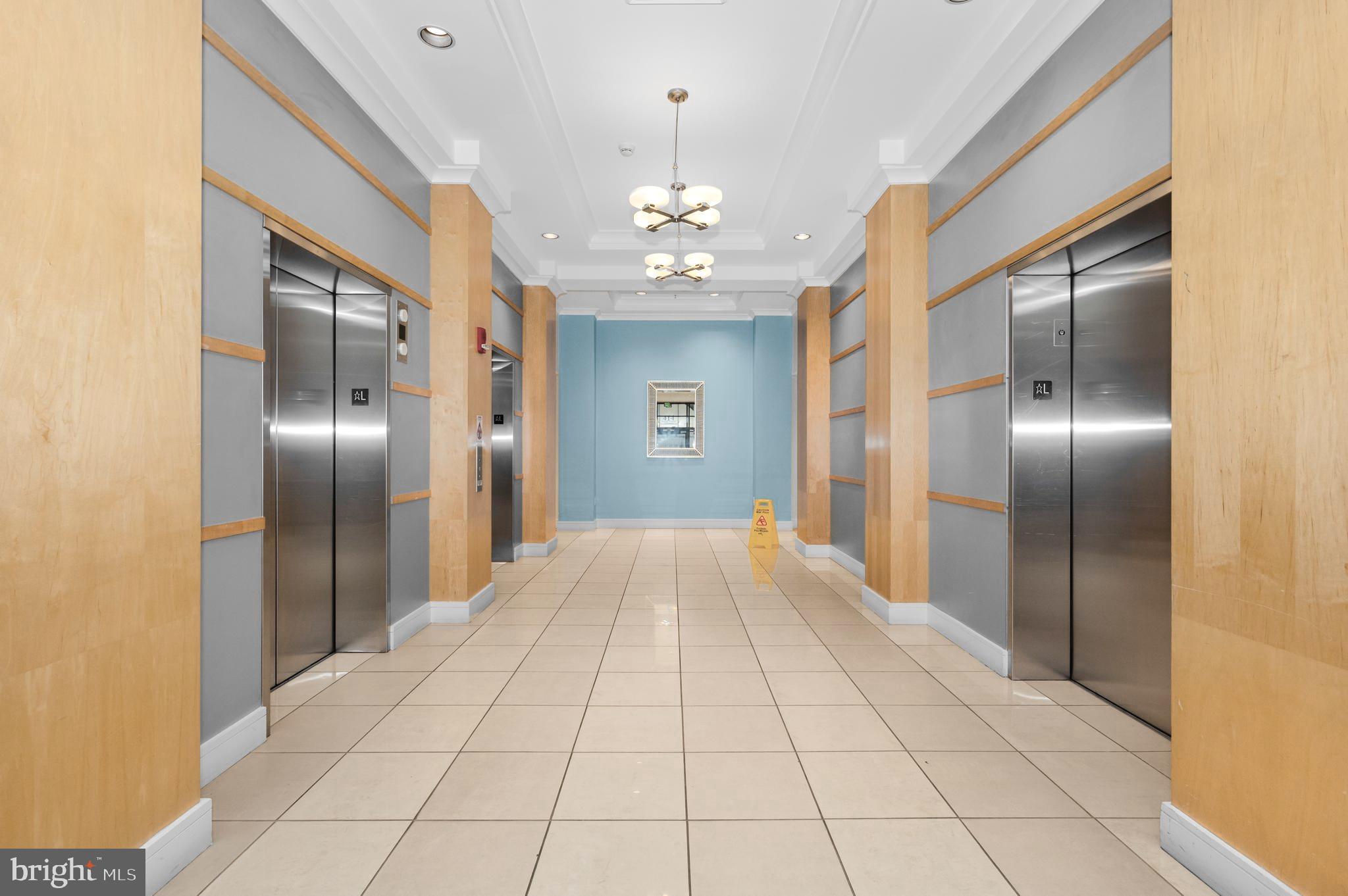 414 Water Street, Unit 2805 Baltimore, MD 21202 - Photo 3 of 24 a view of an empty room with glass door