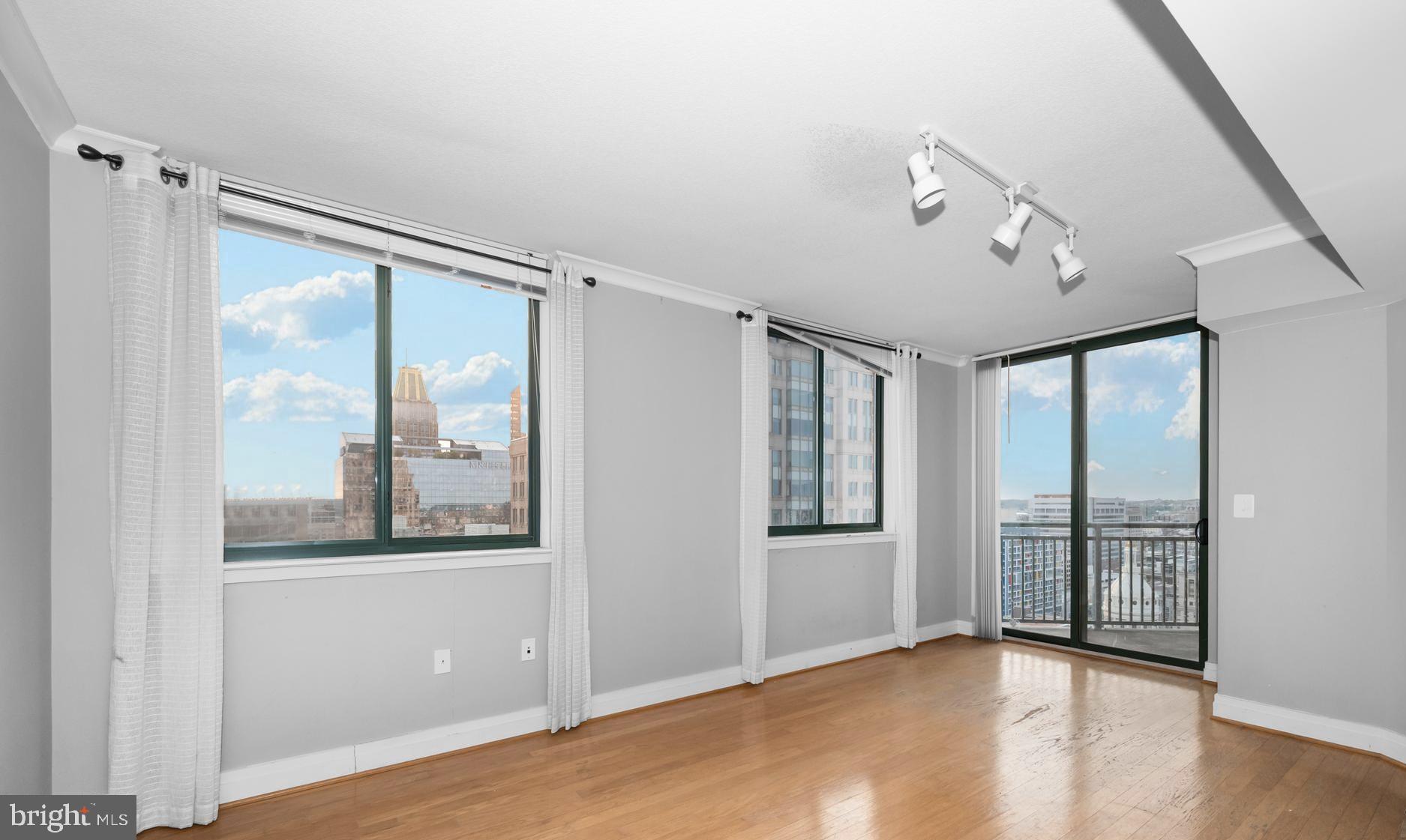 414 Water Street, Unit 2805 Baltimore, MD 21202 - Photo 9 of 24 a view of an empty room with a window