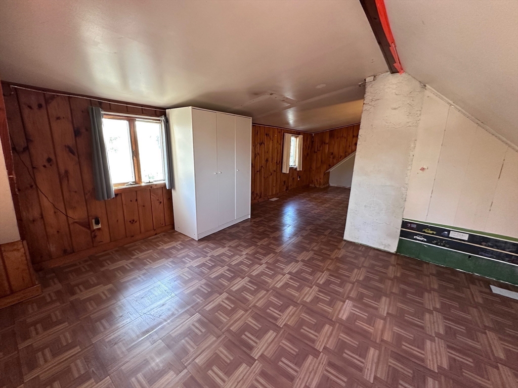 4 Martin Street Wareham, MA 02532 - Photo 19 of 33 a view of a livingroom with wooden floor and stairs