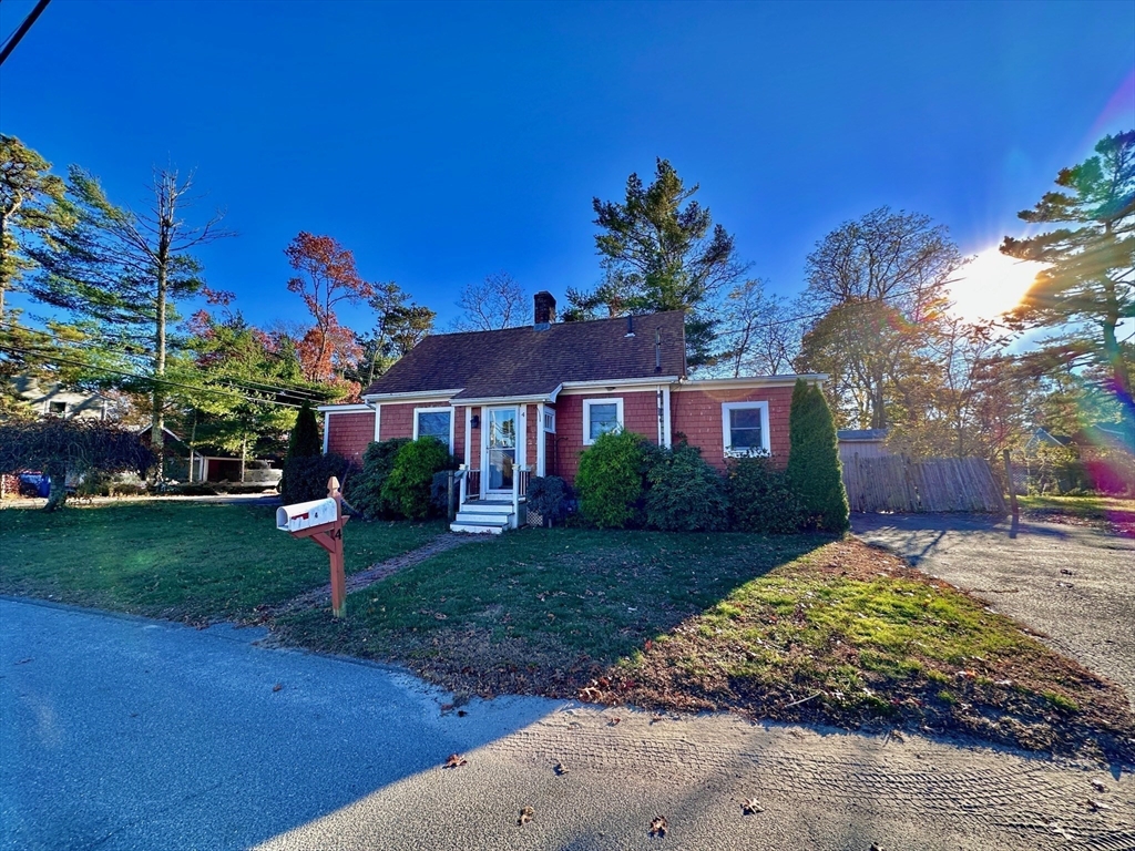 4 Martin Street Wareham, MA 02532 - Photo 2 of 33 a front view of a house with a garden