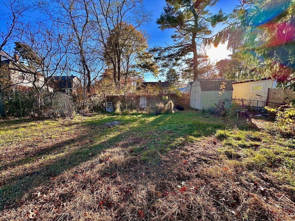 4 Martin Street Wareham, MA 02532 - Photo 21 of 33 a backyard of a house with lots of green space