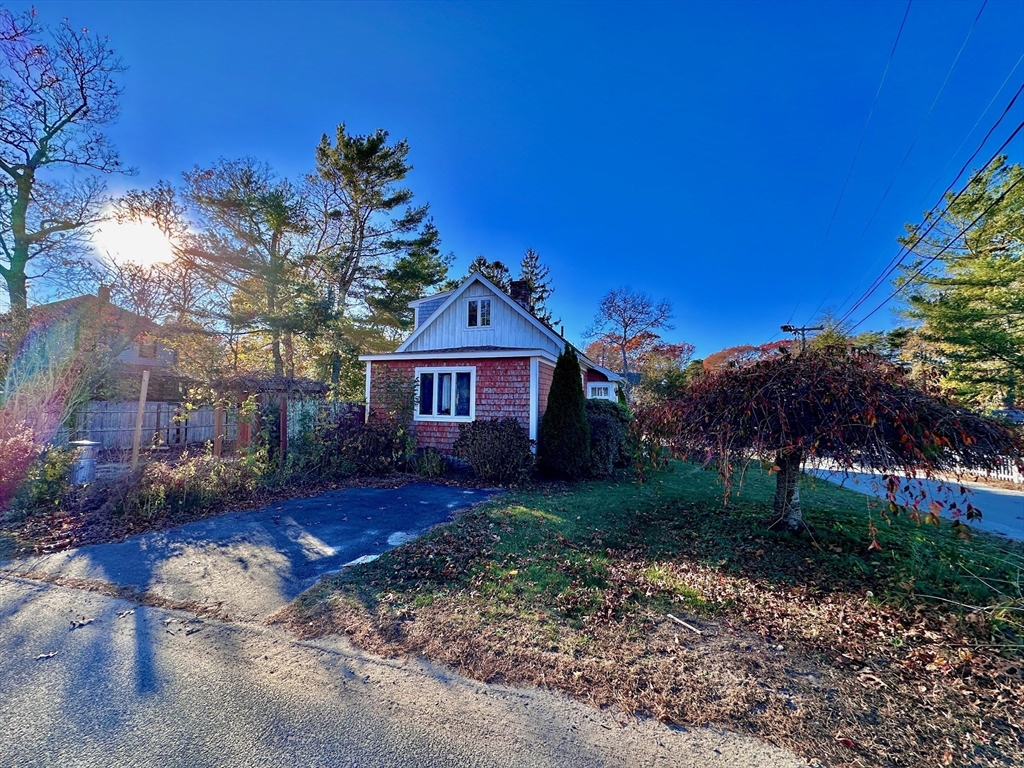 4 Martin Street Wareham, MA 02532 - Photo 4 of 33 a front view of a house with a yard