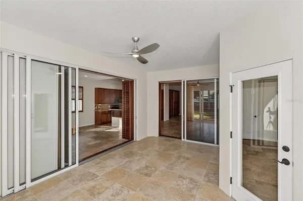 a view of an empty room with windows