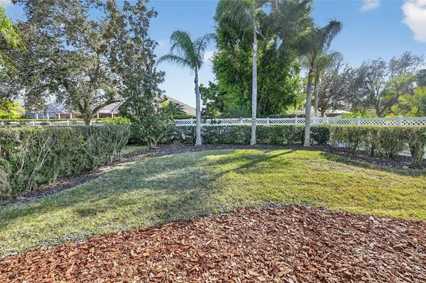 an aerial view of a houses with a lake view