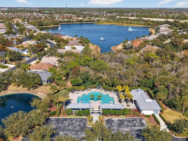 a kitchen with a table chairs refrigerator and cabinets