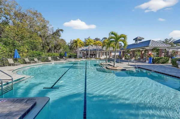 a view of a swimming pool with a patio