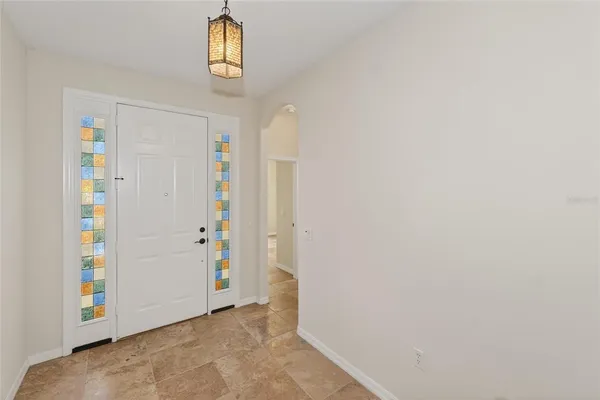 a view of an entryway with wooden floor