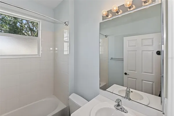 a view of a livingroom with a furniture and chandelier