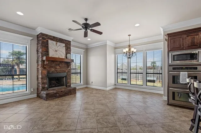 a view of a livingroom with furniture and a ceiling fan