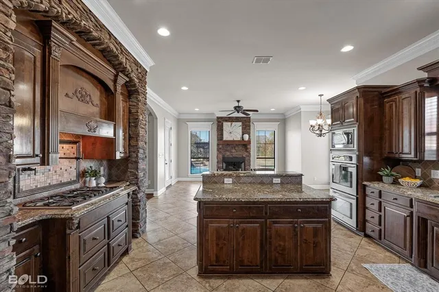 a bedroom with bed and a chandelier