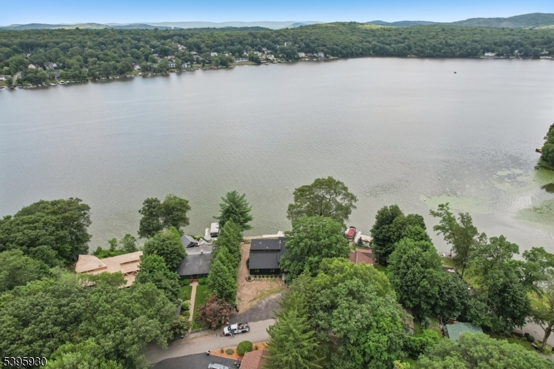 12 Rocky Point Road West Milford, NJ 07421 - Photo 39 of 50 an aerial view of green landscape with trees houses and lake view