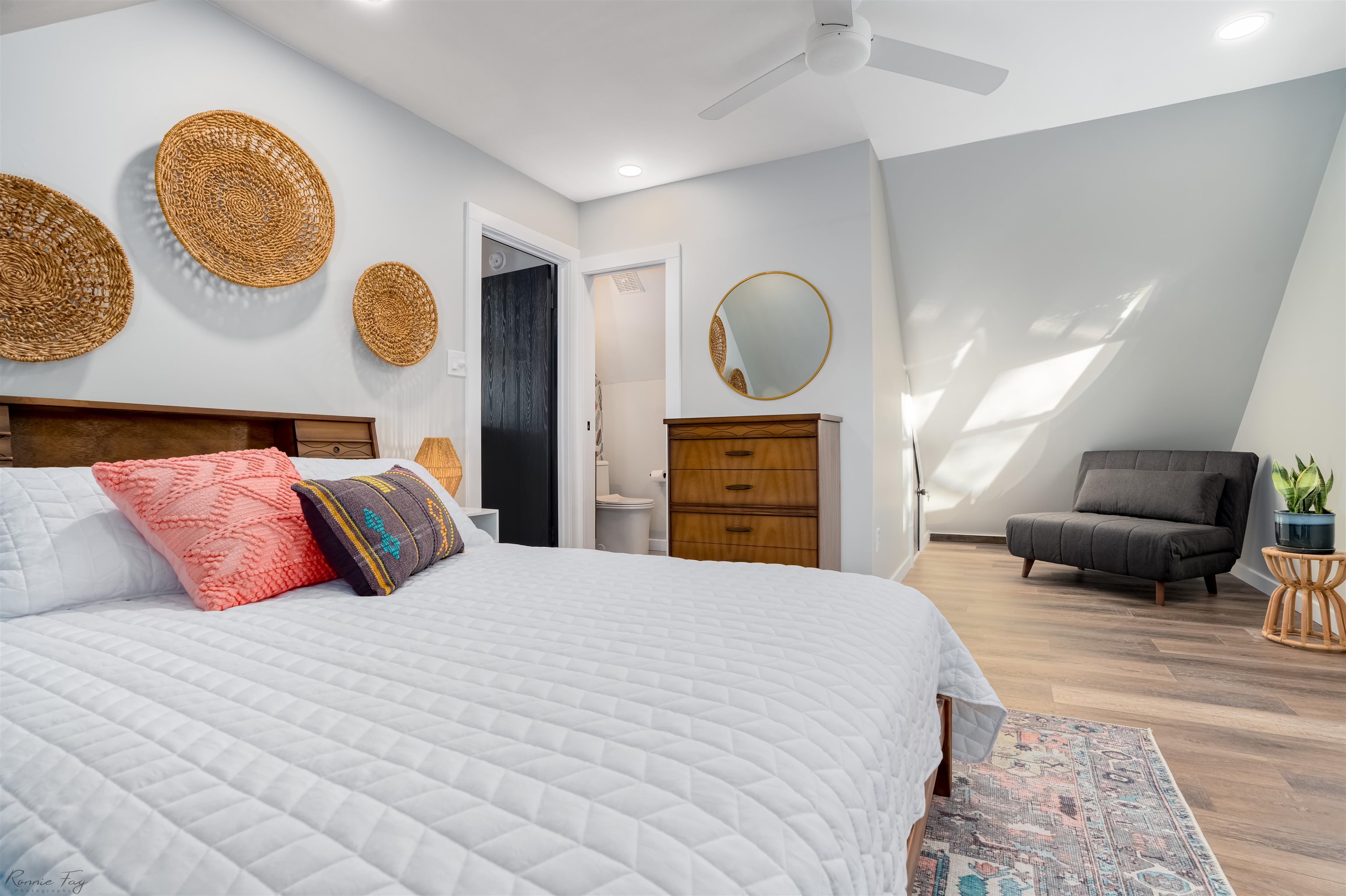 512 Robin Cape Villas, NJ 08251 - Photo 16 of 18 a bedroom with a bed and painting on the wall