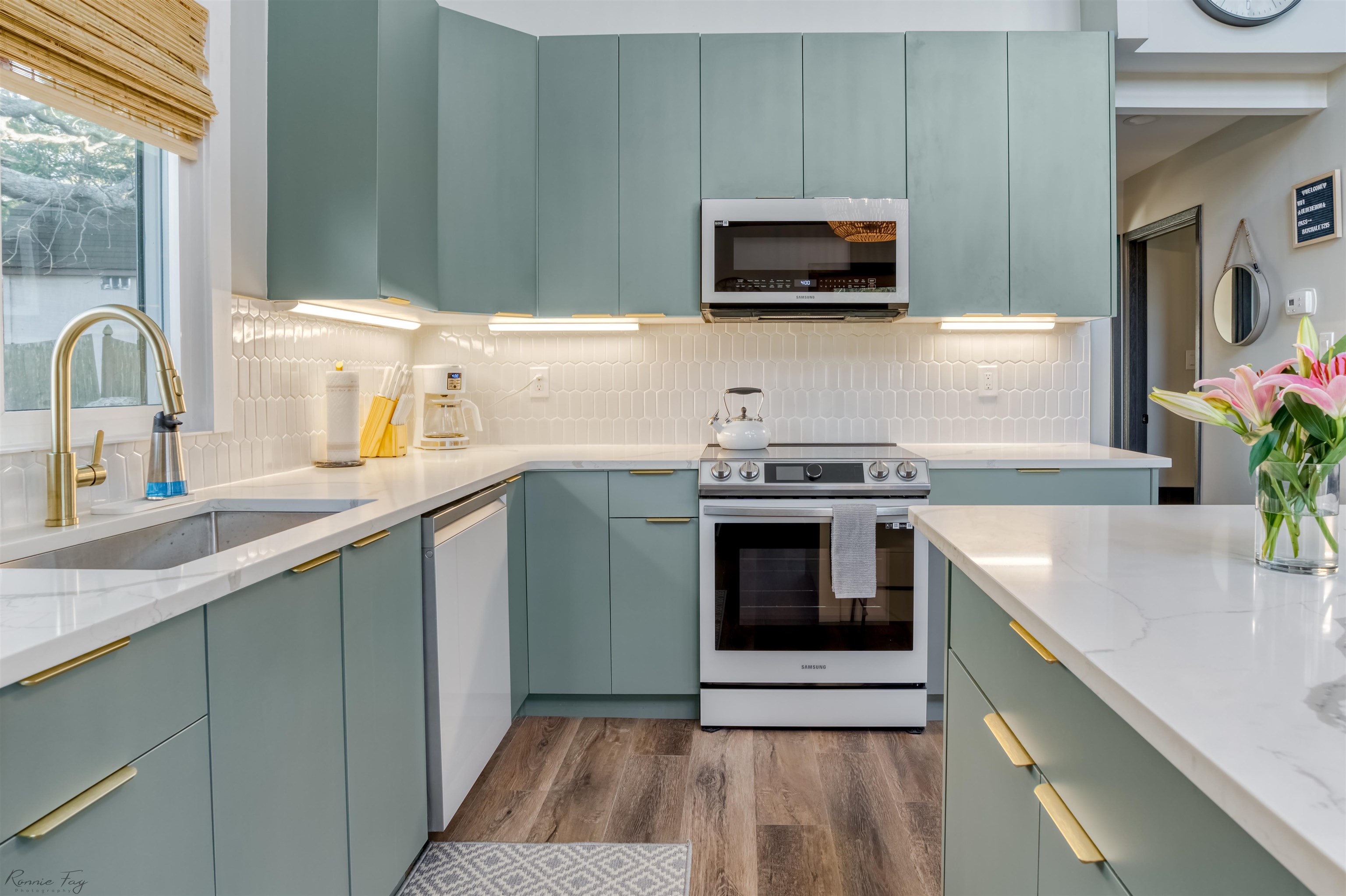 512 Robin Cape Villas, NJ 08251 - Photo 4 of 18 a kitchen with stainless steel appliances a stove a sink a microwave and cabinets