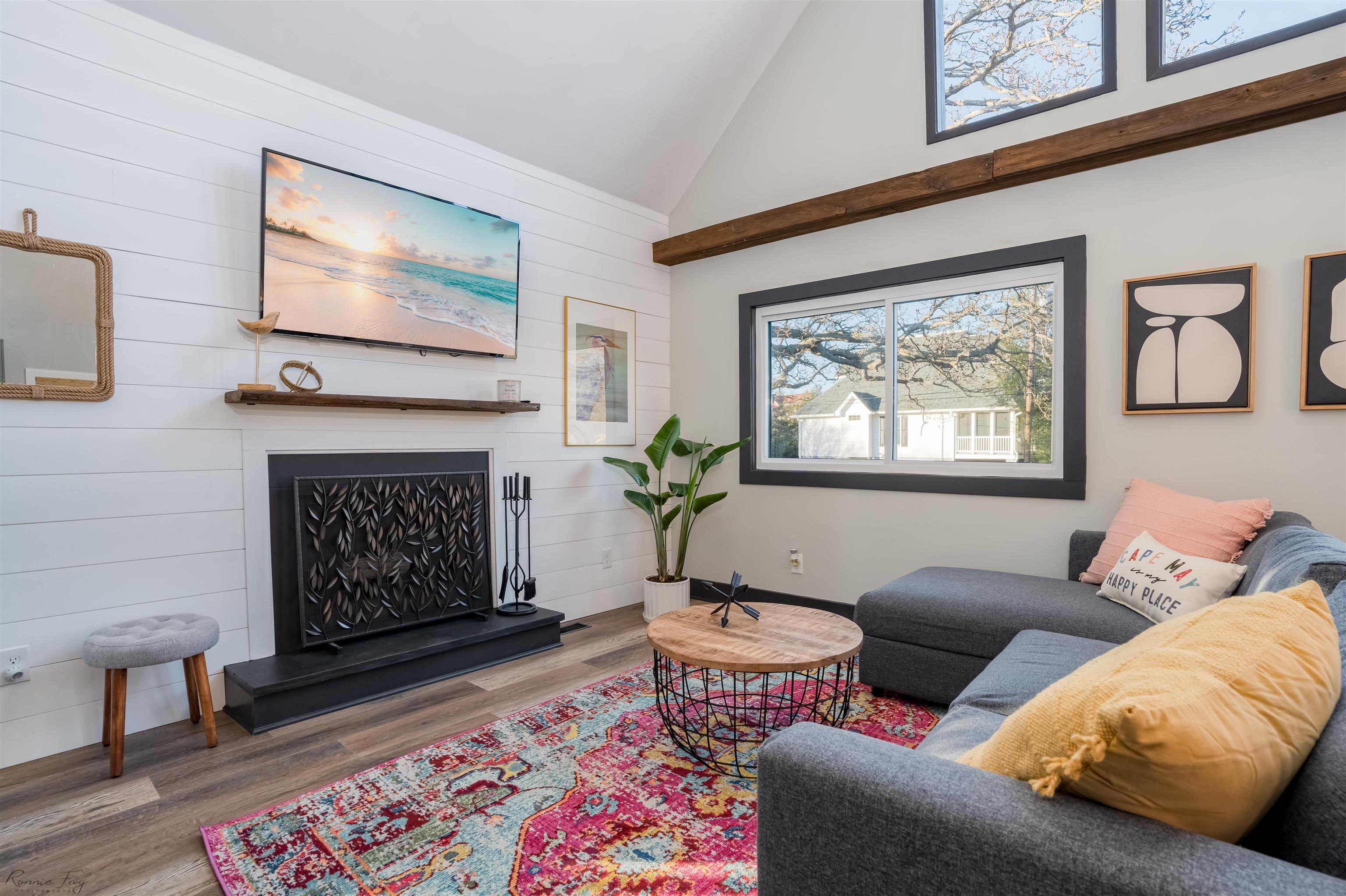 512 Robin Cape Villas, NJ 08251 - Photo 6 of 18 a living room with furniture a flat screen tv and a fireplace