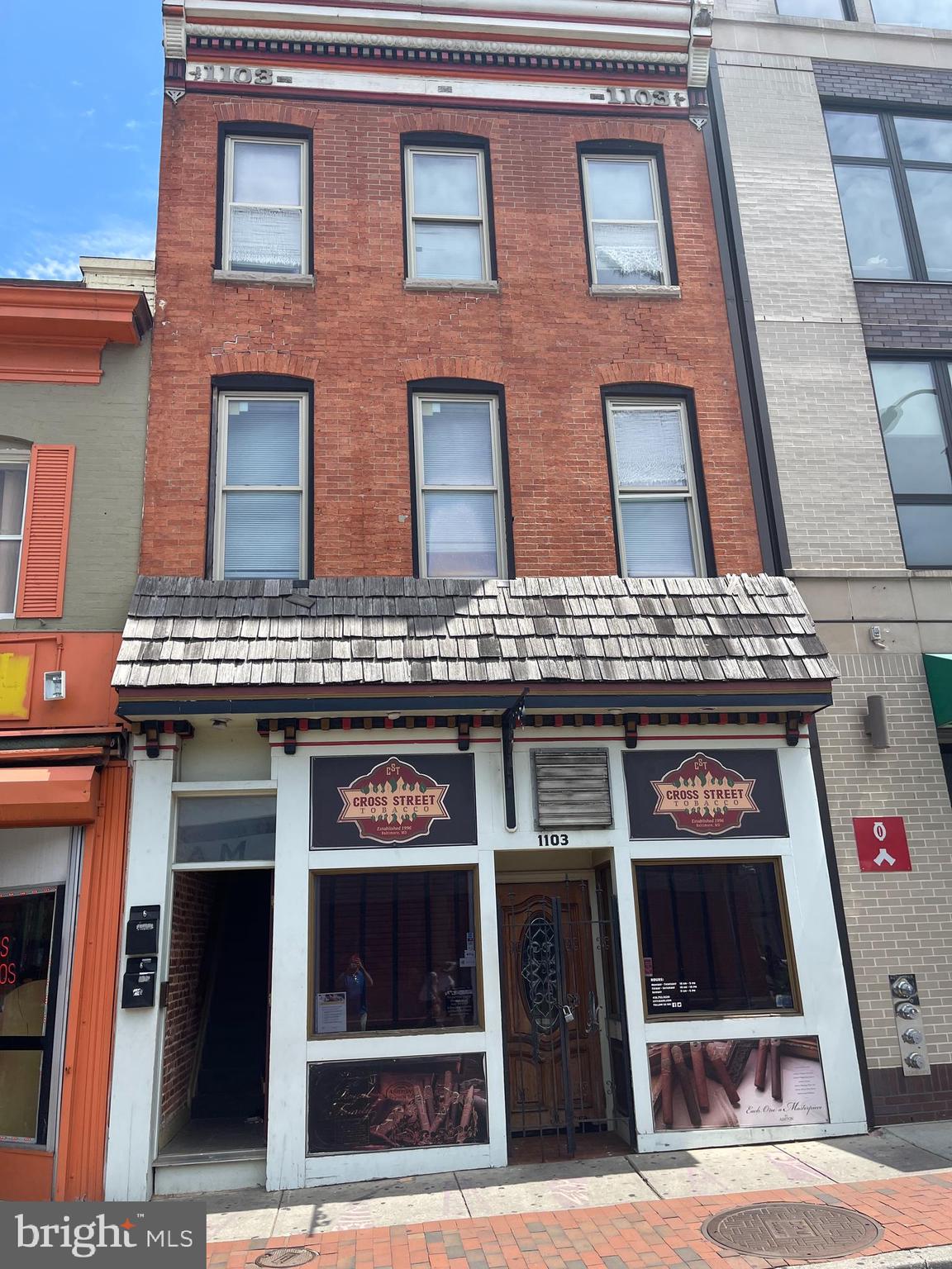 1103 Light Street, Unit B Baltimore, MD 21230 - Photo 23 of 23 a building with glass door