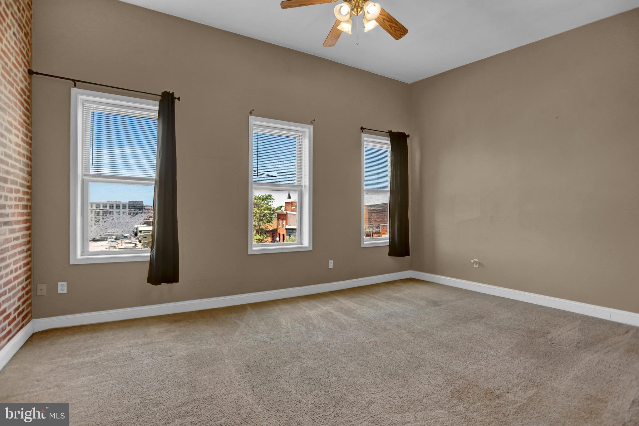 1103 Light Street, Unit B Baltimore, MD 21230 - Photo 3 of 23 an empty room with windows