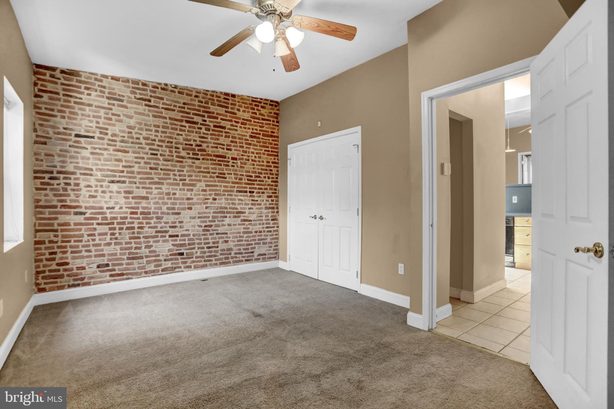 1103 Light Street, Unit B Baltimore, MD 21230 - Photo 4 of 23 a view of an empty room and chandelier fan